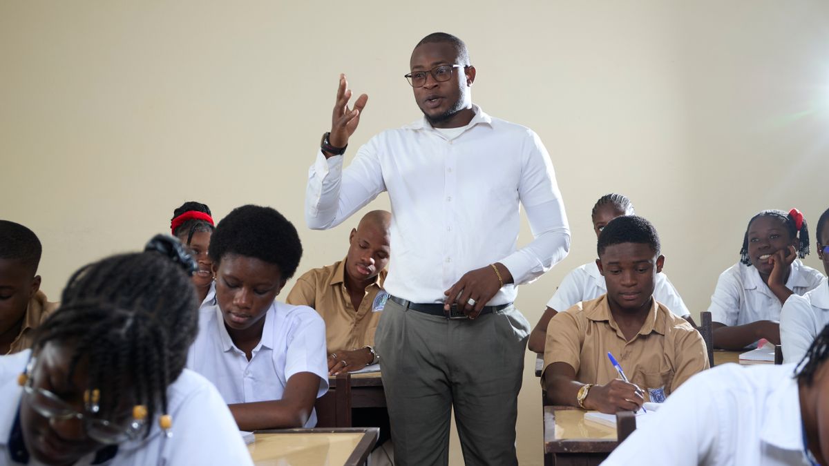 A teacher leading a classroom discussion with engaged students